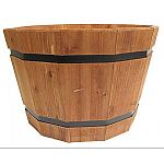 Use barrel tubs in multiples of two or three in various sizes to add visual interest. Also great for vegetable container gardening.